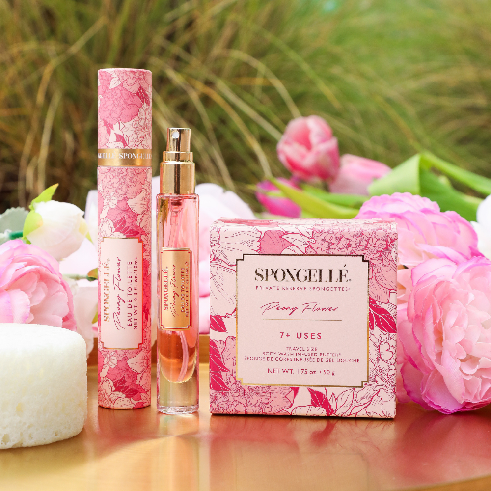 Peony Flower travel fragrance and Spongette set displayed beside pink flowers