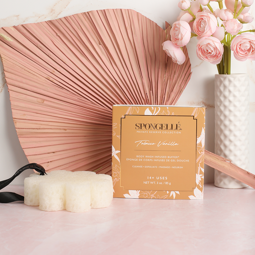 Tobacco Vanilla boxed buffer displayed with a decorative fan and flowers
